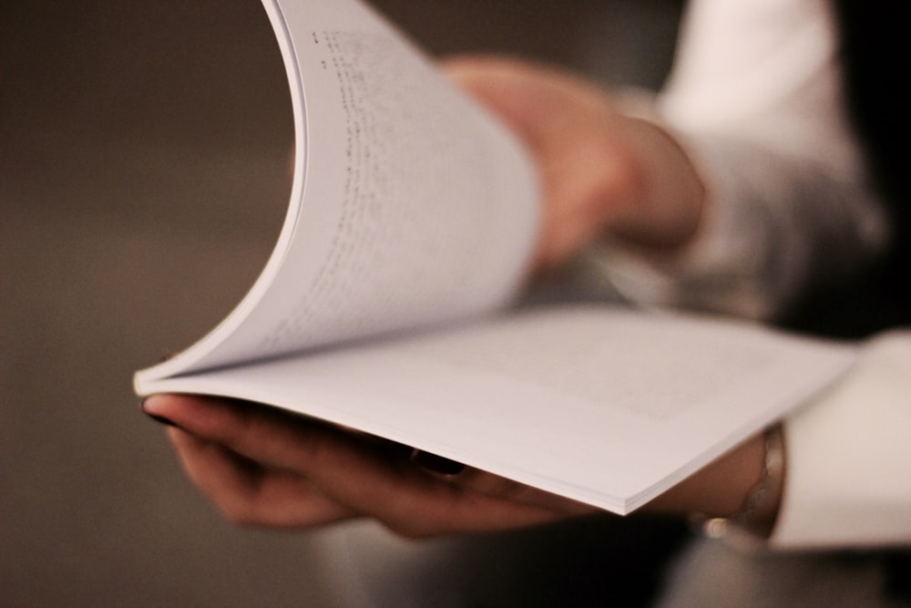 person holding book