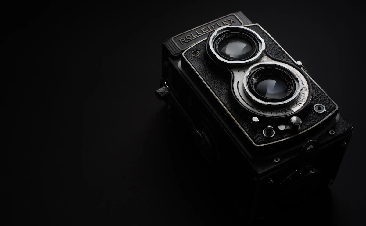 A cinema camera lit against a dark set, the kind of production we bring to every client build.