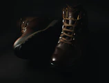 Top view of durable dark brown jungle shoes with laces tied tightly ready for outdoor use.