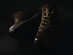 Top view of durable dark brown jungle shoes with laces tied tightly ready for outdoor use.