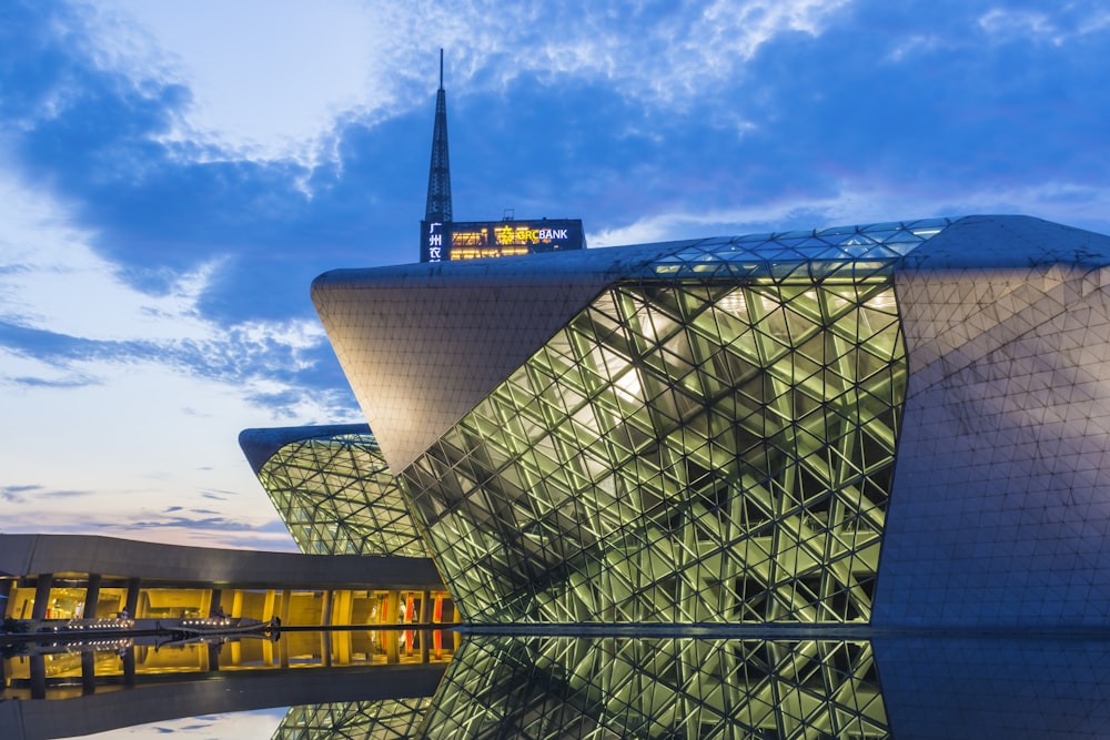 gray and green structure under blue sky