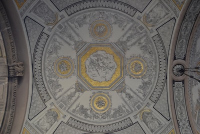 photo of white, gray, and yellow building ceiling