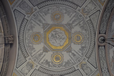 photo of white, gray, and yellow building ceiling