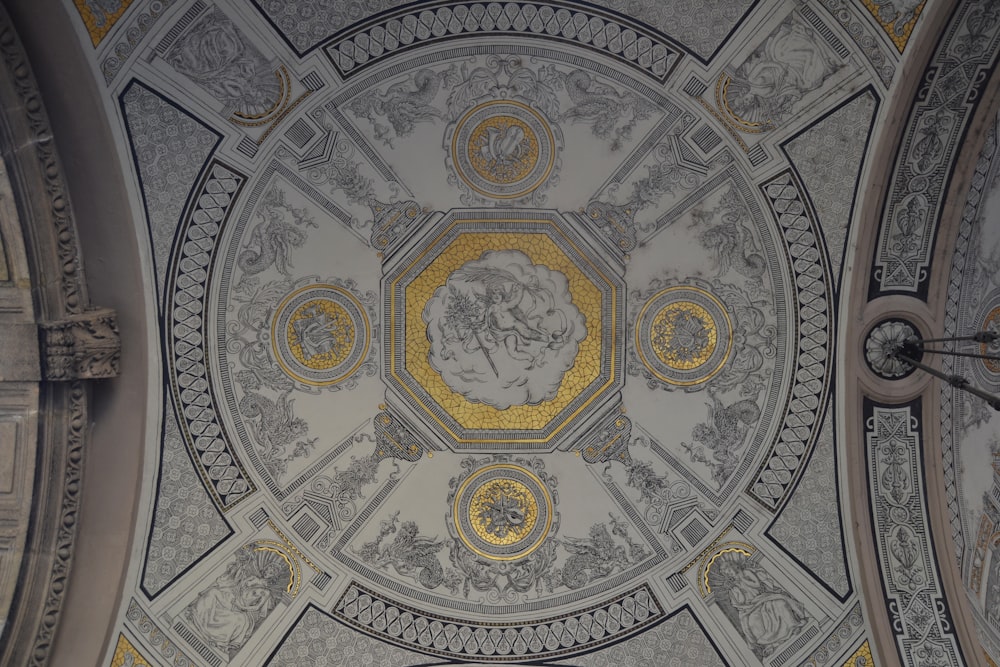 photo of white, gray, and yellow building ceiling