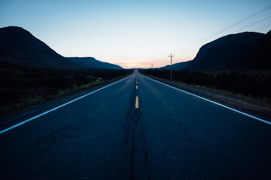 gray concrete road during nighttime in Tablelands Trail Canada