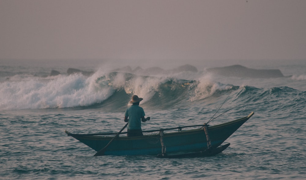 man on boat during daytime