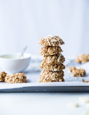 stack of foods beside white ceramic bowl