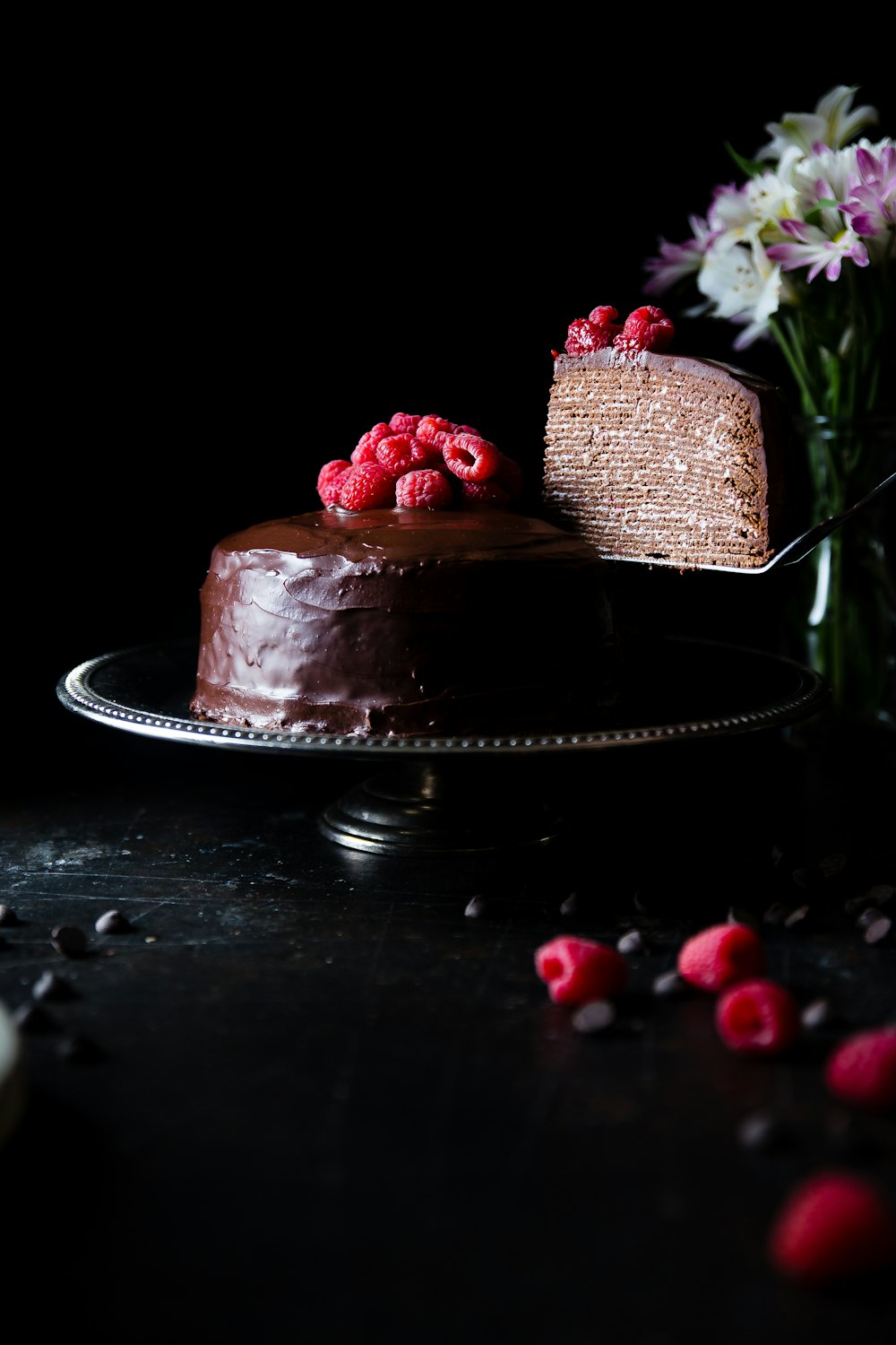 chocolate covered cake on stainless steel tray