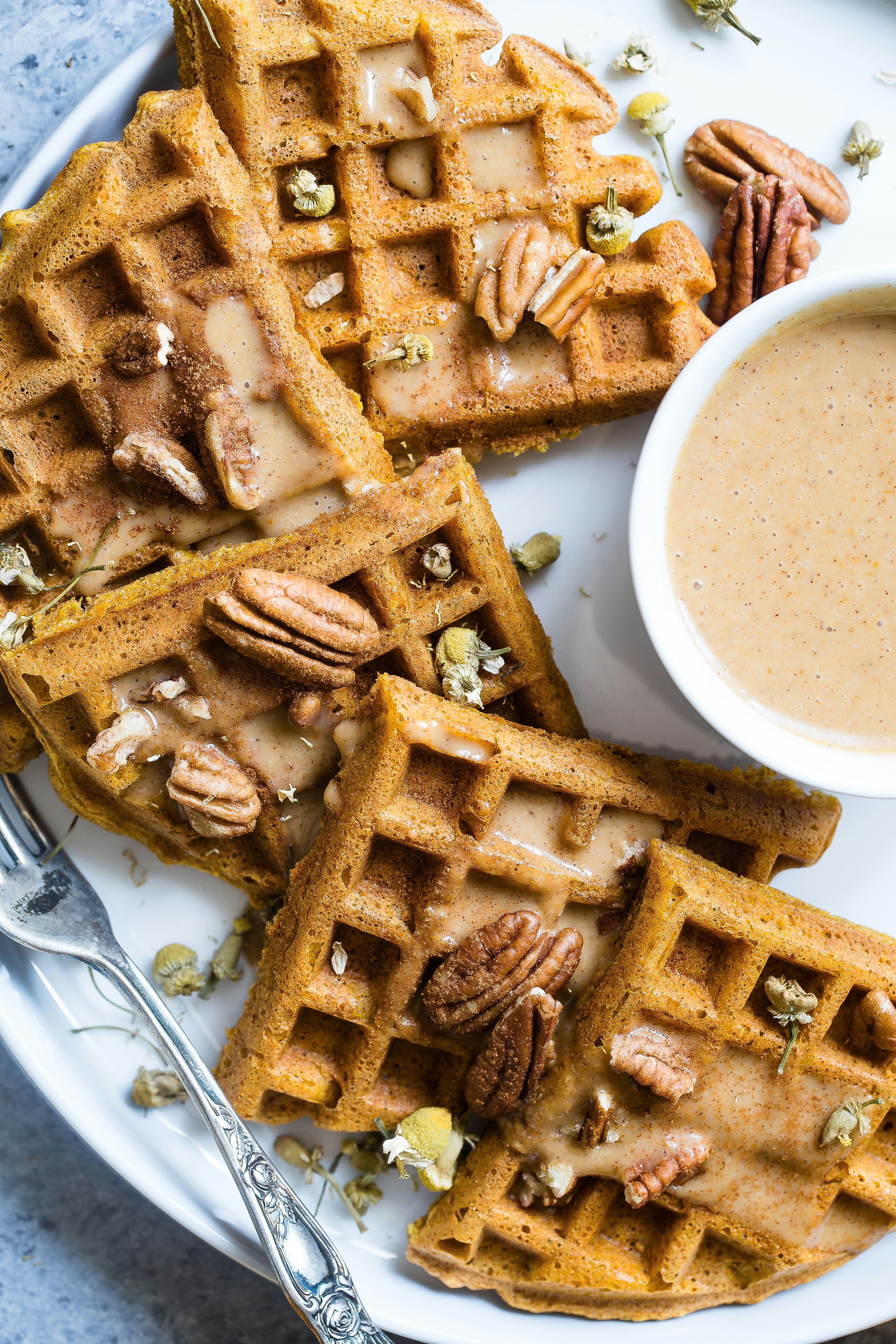 waffle with cream on white ceramic plate