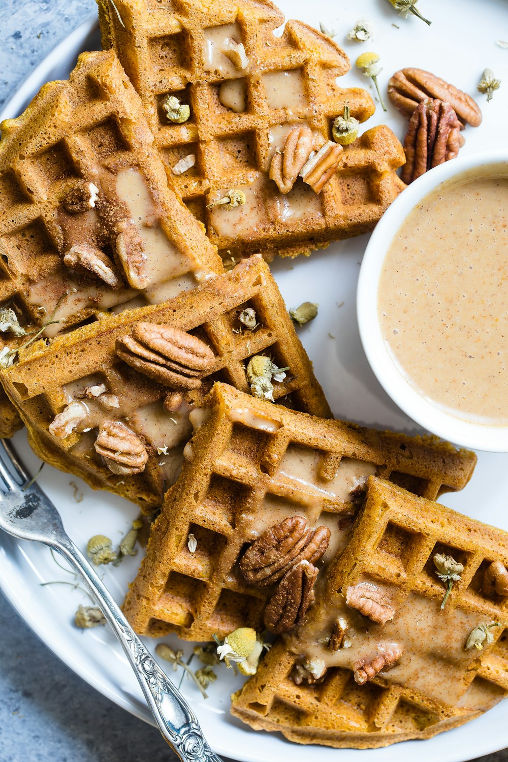 waffle with cream on white ceramic plate