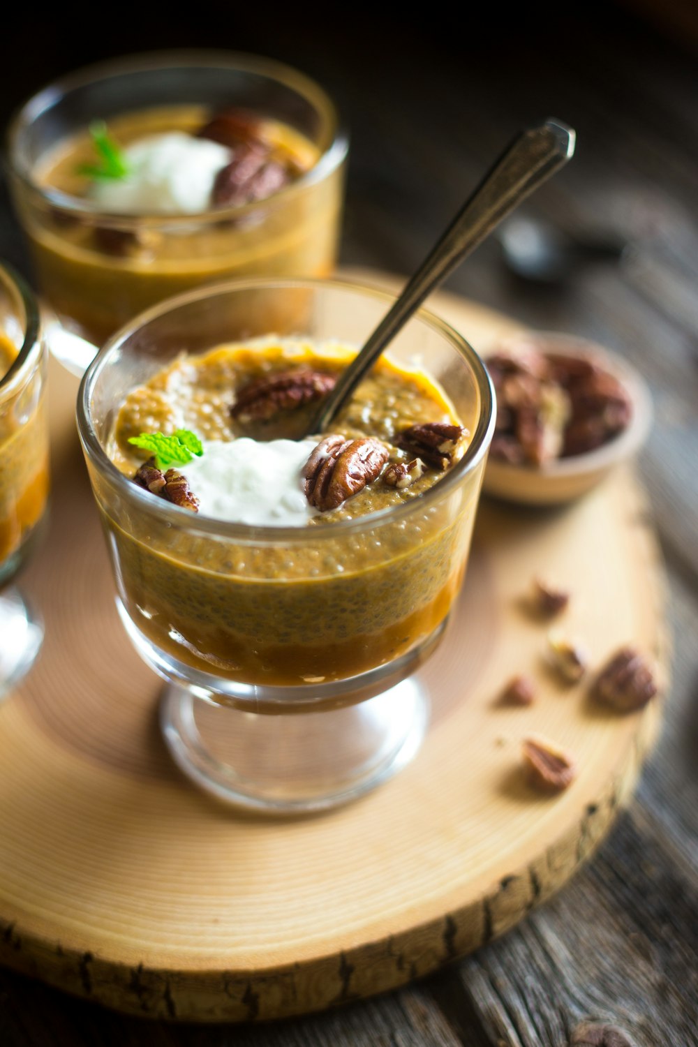 selective focus photography of clear sorbet glass filled with dessert