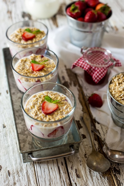 milk, strawberry, and cornflakes in glasses