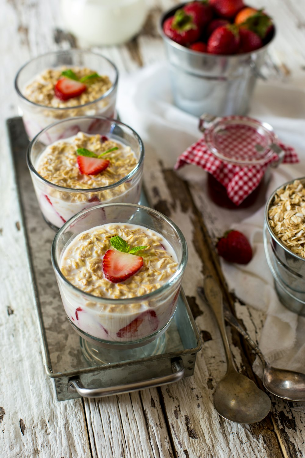 milk, strawberry, and cornflakes in glasses