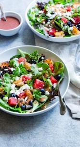 vegetable salad on white ceramic bowl