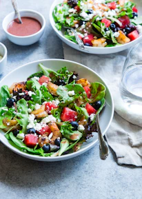 vegetable salad on white ceramic bowl