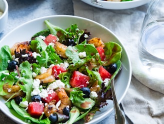 vegetable salad on white ceramic bowl