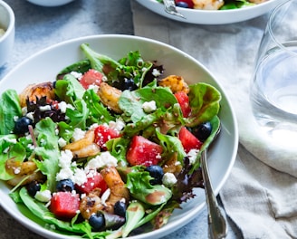 vegetable salad on white ceramic bowl