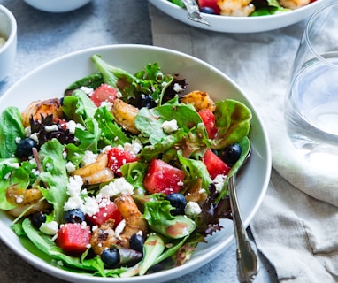 vegetable salad on white ceramic bowl