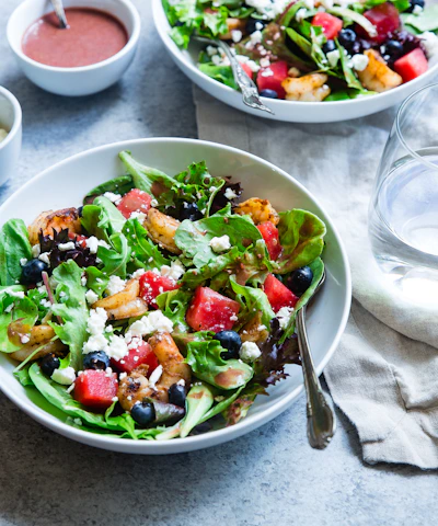vegetable salad on white ceramic bowl