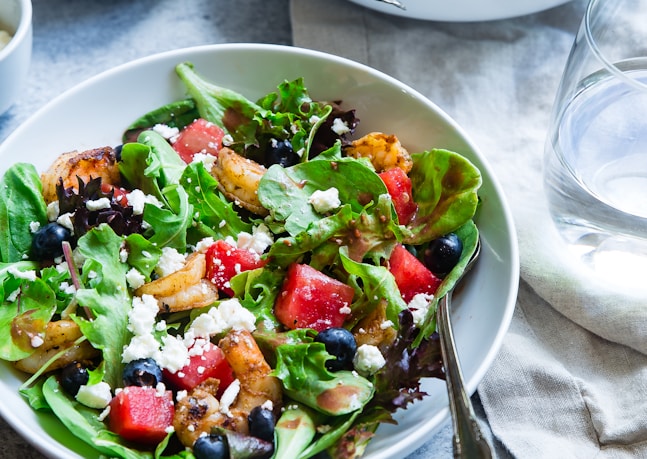 vegetable salad on white ceramic bowl