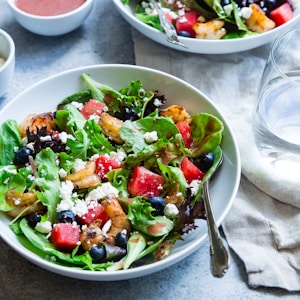 vegetable salad on white ceramic bowl