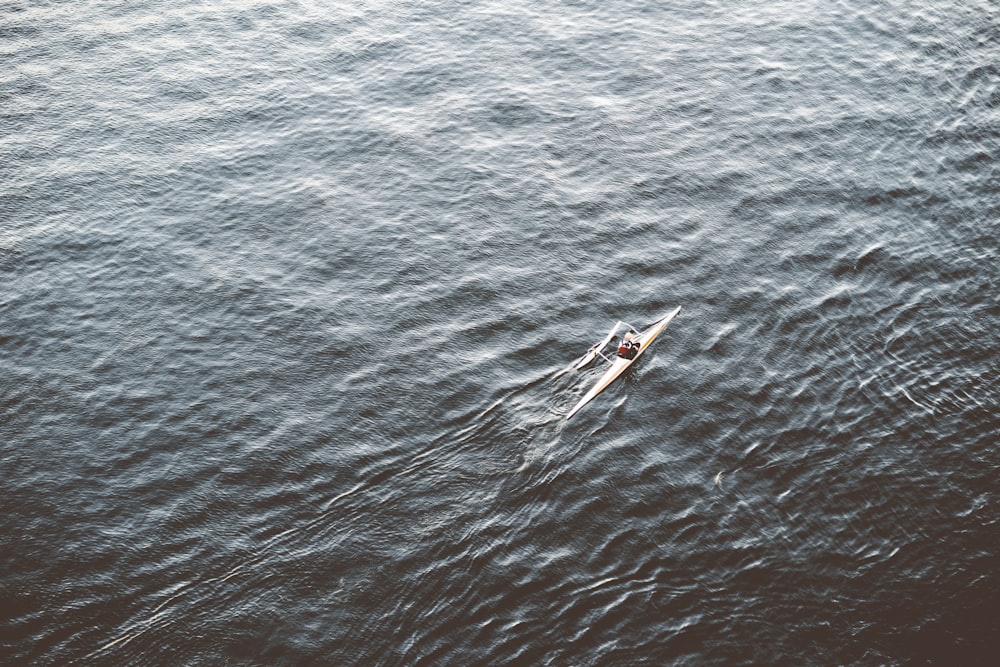 person riding boat during day time