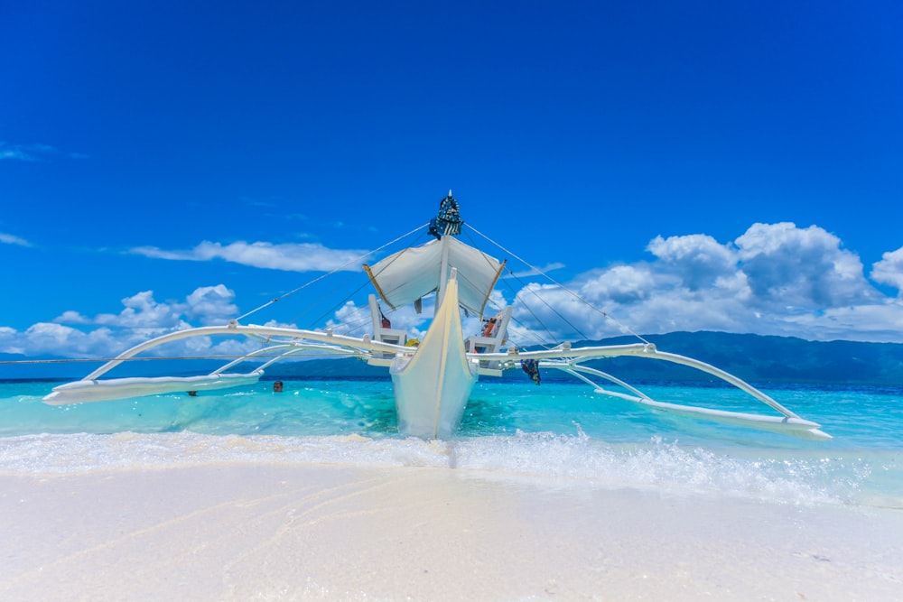 docked fishing boat on seashore