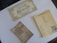 A collection of themed cards is arranged on a flat surface. There is a decorative ticket marked 'Platform 9 3/4' indicating a fictional journey to Hogwarts. Two student ID cards with Hogwarts branding are placed nearby, both featuring forms to fill out personal details.