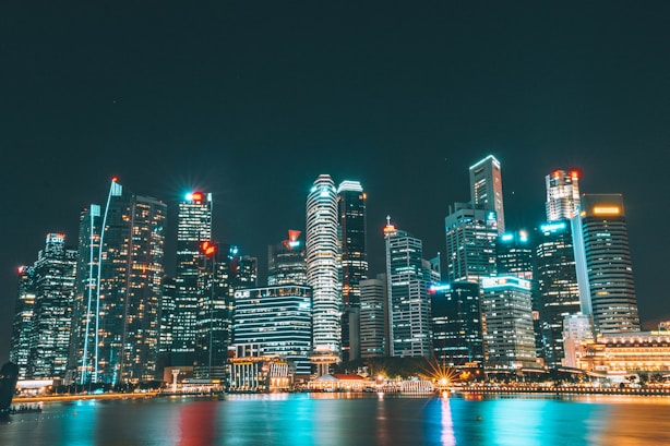 city lights under black clouds