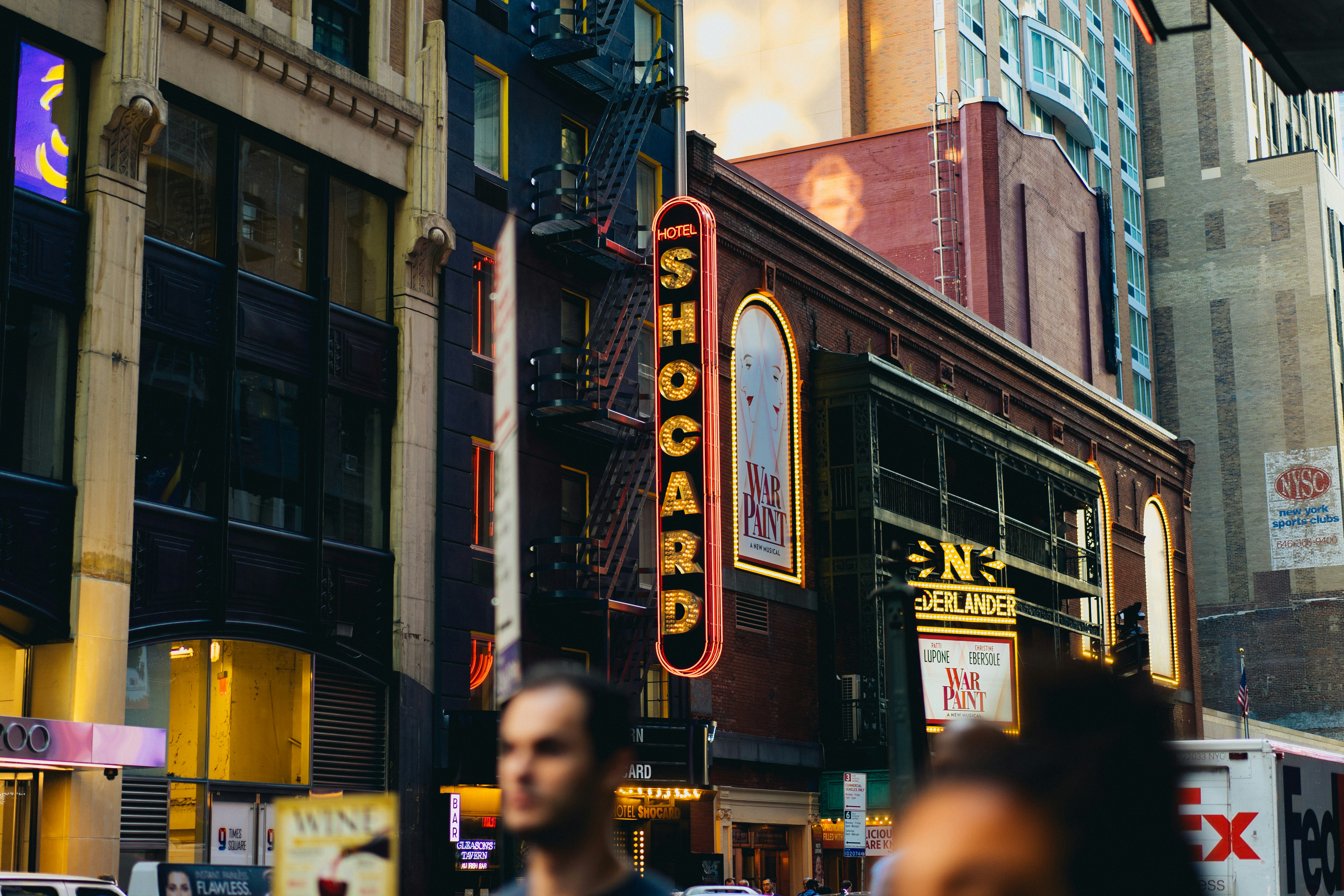 people walking beside high buildings during daytime, 