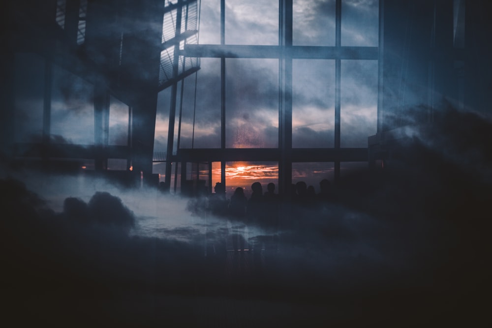 silhouette photography of people standing inside building