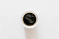 Freshly brewed specialty coffee served in a minimalist black cup.