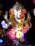 A beautifully decorated statue of Lord Ganesha adorned with vibrant flowers and intricate jewelry. The statue features detailed craftsmanship with vibrant colors and a serene expression.