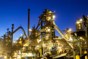 Wide shot of a modern industrial facility with newly installed boilers shining under bright lights