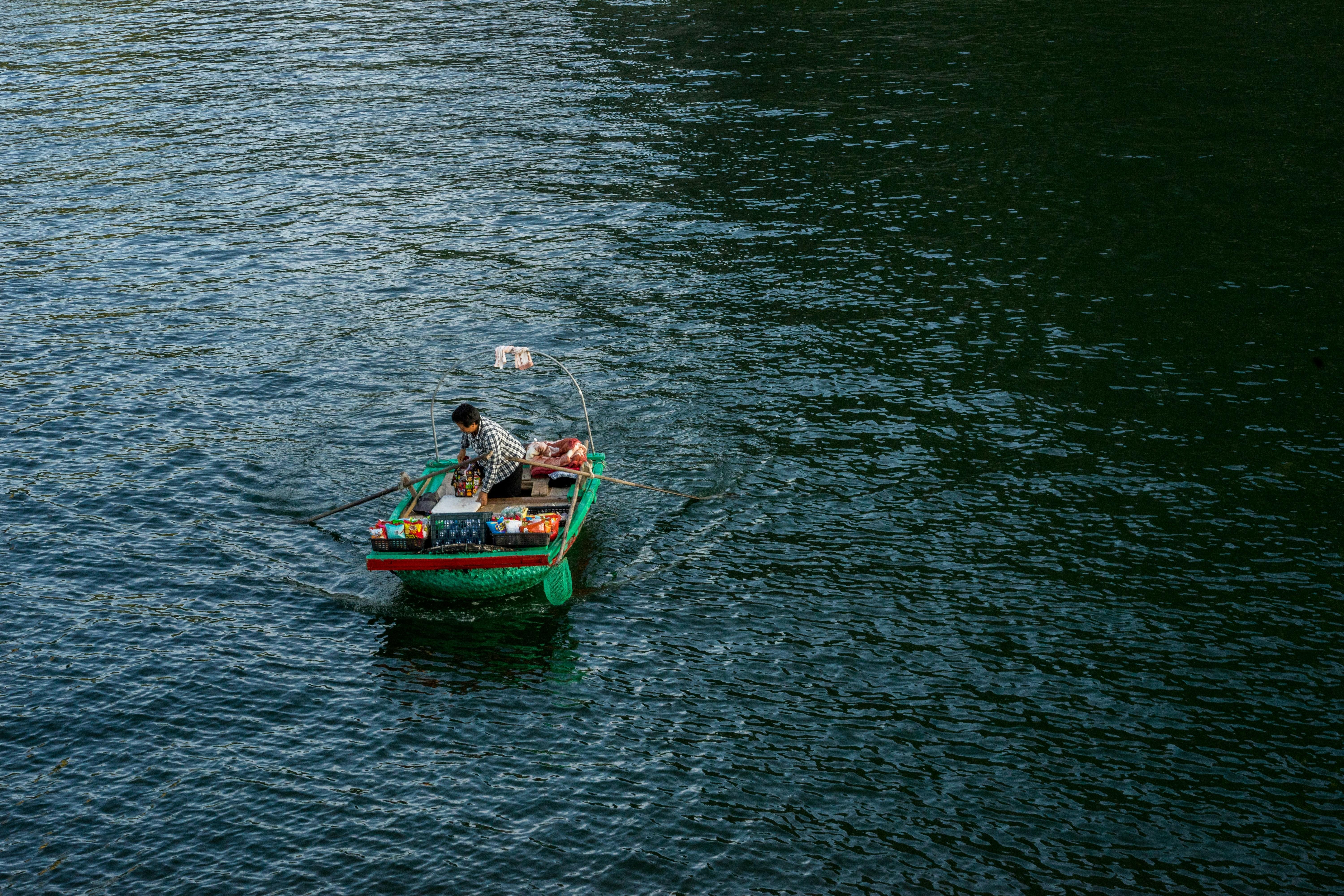 person on green boat