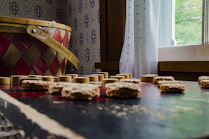 A family enjoying a game of checkies at home.