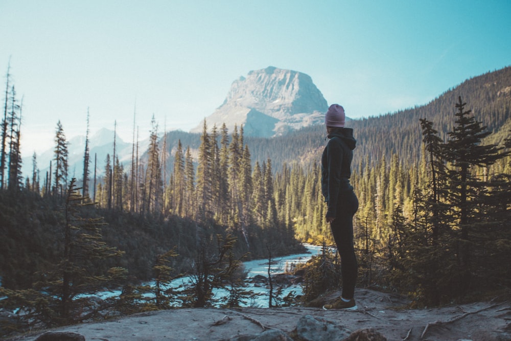 person staring at lake during daytime