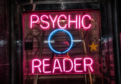 turned on red Psychic Reader neon sign