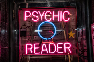 turned on red Psychic Reader neon sign