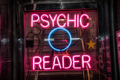 turned on red Psychic Reader neon sign