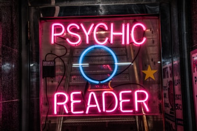turned on red Psychic Reader neon sign