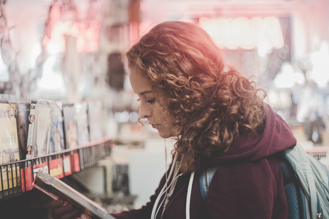 woman reading book in the streets