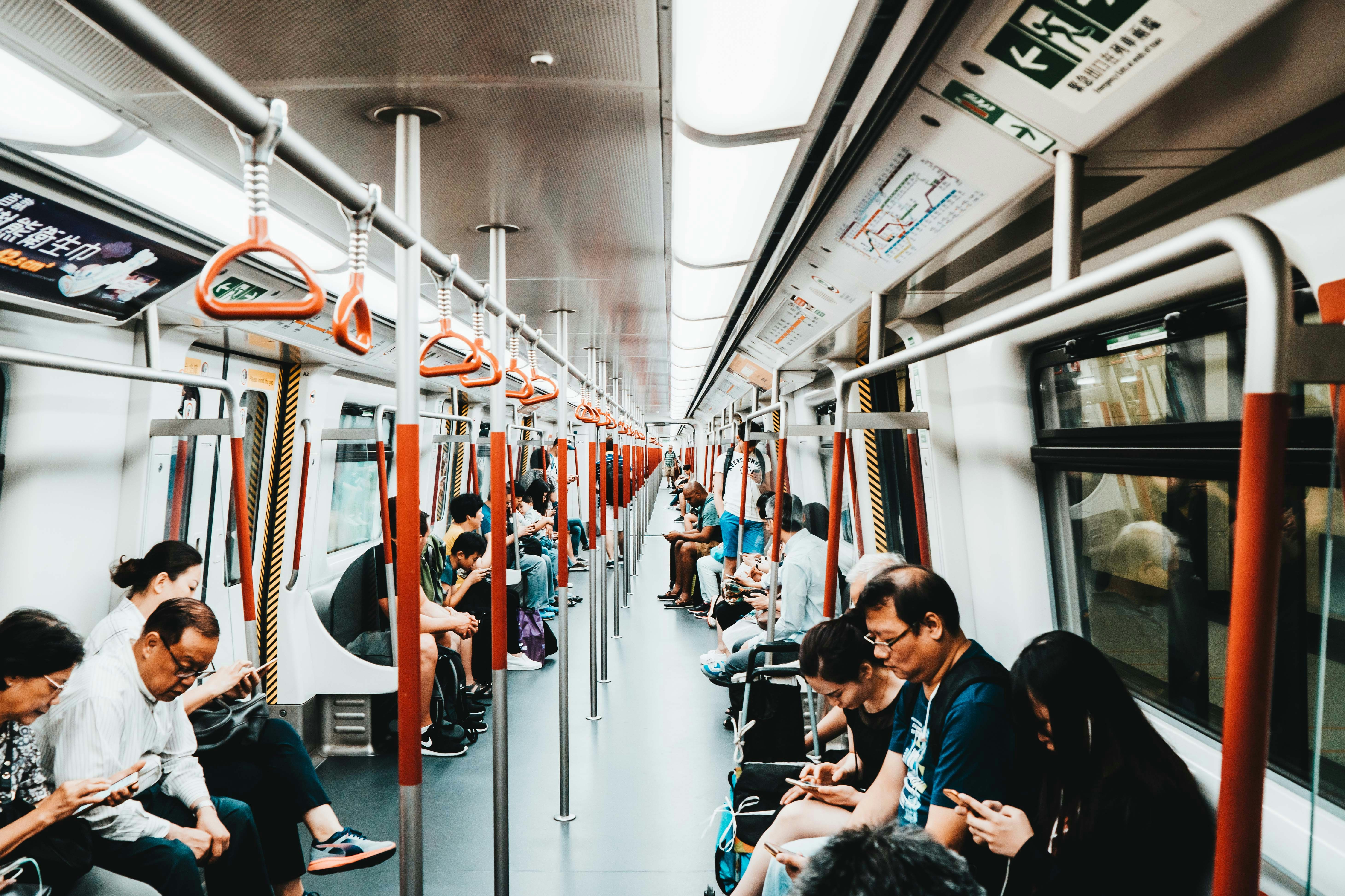 lots of people riding electric train