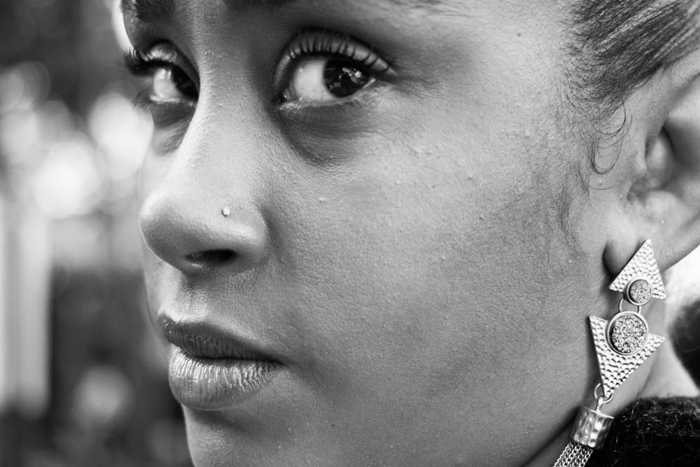 close-up and grayscale photo of woman