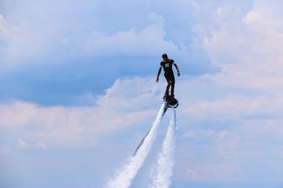 man riding water sports board