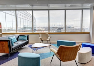 ottomans and chairs inside the room