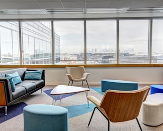 ottomans and chairs inside the room