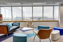 ottomans and chairs inside the room