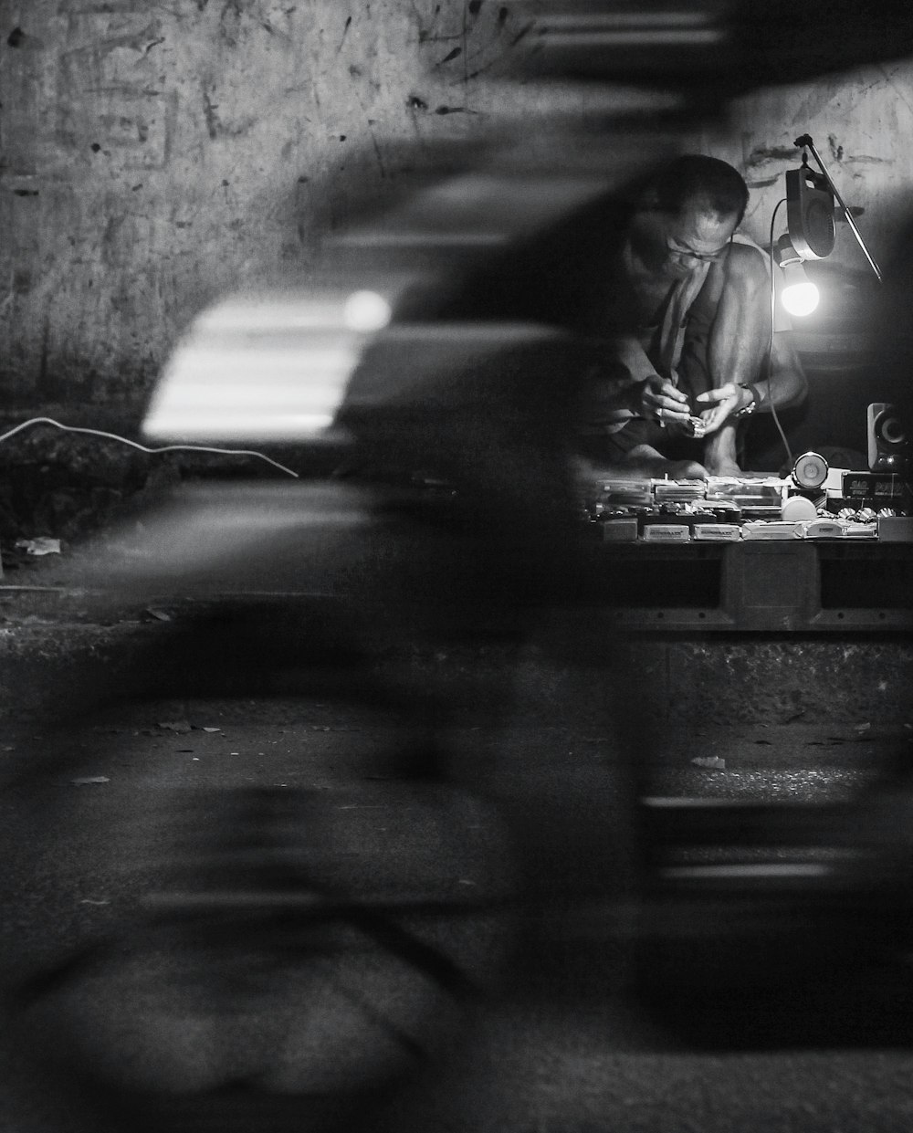 grayscale photography of man in table