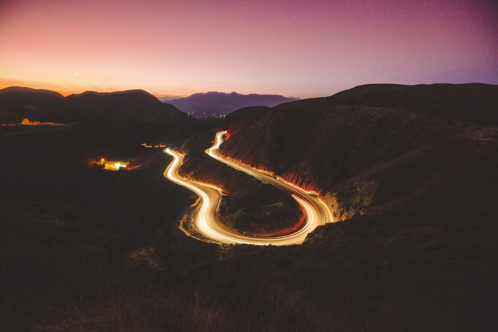 time lapse photography of cars on road during night time